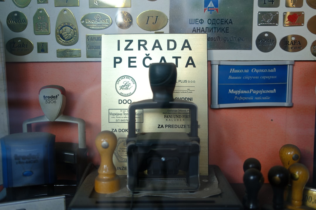 Collection of vintage rubber stamps and plaques on display.